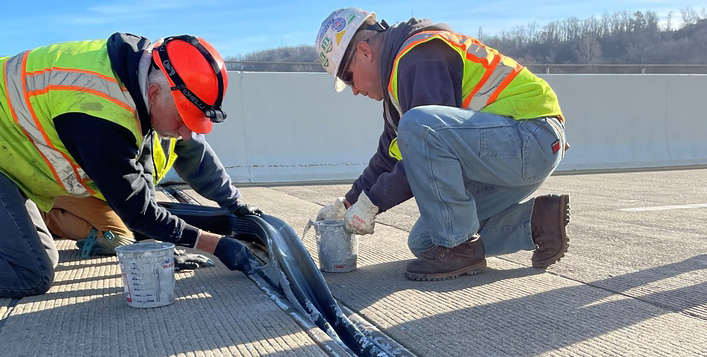 Crew installing a D.S. Brown expansion joint on a bridge deck
